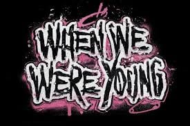 Graffiti-style text reading When We Were Young with pink and white lettering on black background