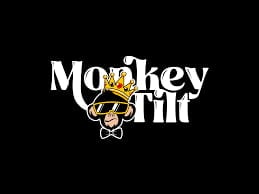 Monkey Lift logo featuring a cartoon monkey lifting a barbell on black background